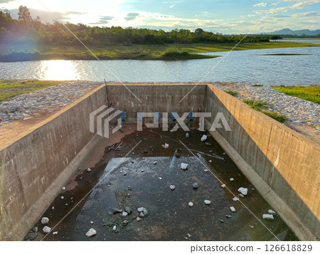 dam on the river, am wall, Howell Bunker valve in operation, Pressurized water outlet from dam wall, water from a pipeline, factory industrial, showcasing water management infrastructure 126618829