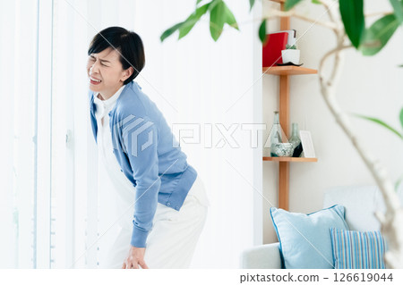 Middle-aged woman suffering from knee pain Middle-aged woman suffering from knee pain 126619044