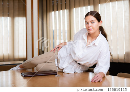 Sexual office secretary posing on table. Business concept 126619115