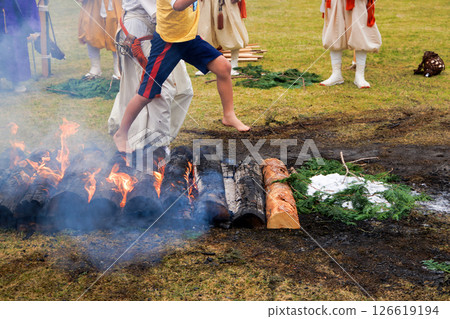 A lively boy taking part in a fire walking ceremony 126619194
