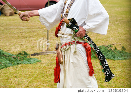 Yamabushi sword-waving at the fire-walking festival 126619204