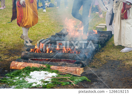 Women participating in a fire walking ceremony Women participating in a fire walking ceremony 126619215