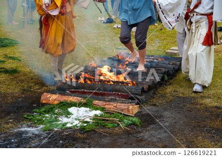 Women participating in a fire walking ceremony Women participating in a fire walking ceremony 126619221