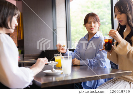 A woman talking in a cafe A woman talking in a cafe 126619739