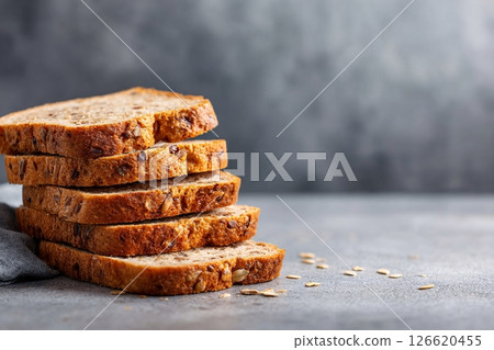 tempting brown bread in the minimalist corner on a light gray background 126620455