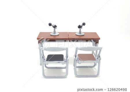 Two Microphones on Desks with Chairs in a Studio 126620498