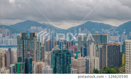View of a Modern City With Dense Skyscrapers and Mountain Backdrop 126620590