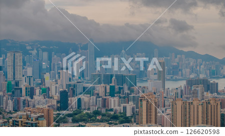 View of a Modern City With Dense Skyscrapers and Mountain Backdrop View of a Modern City With Dense Skyscrapers and Mountain Backdrop 126620598