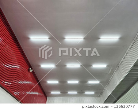 Fluorescent Tube Lights on Warehouse Roof. Fluorescent Tube Lights on Warehouse Roof. 126620777