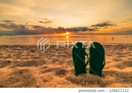 Flip-flops on the Sand at Sunset in Summer 126621132