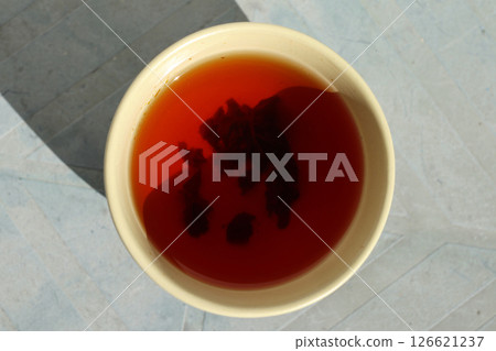 Chinese tea cup with black tea. Chinese tea cup with black tea. 126621237