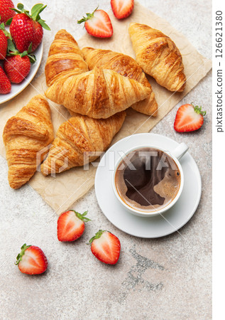 Delicious french breakfast with croissants, coffee and strawberries 126621380