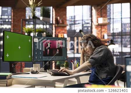 Focused woman using AI chatbot software and copy space display, turning text prompt into photos for a creative project. Young photographer uses text to image generative models on PC. Focused woman using AI chatbot software and copy space display, turning text prompt into photos for a creative project. Young photographer uses text to image generative models on PC. 126621401