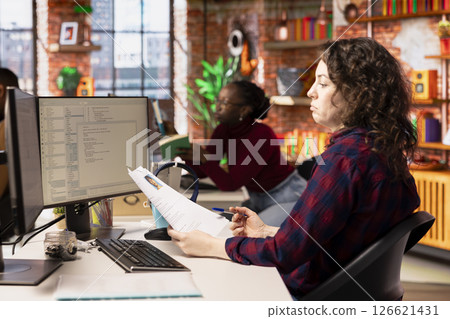 Tech startup HR employer vetting software development position applicants, ensuring their skills are strong enough match for role. Silicon Valley company recruiter assessing candidate work experience 126621431