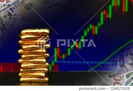 Photo a gold bars the candlestick chart and US dollar background , Fluctuations in gold prices concept. 126621938