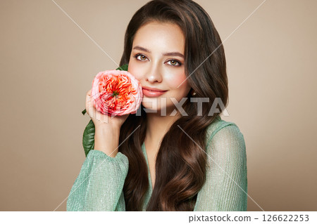 Beautiful young woman a rose flower Beautiful young woman a rose flower 126622253