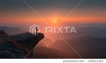 Silhouette of a man standing on a cliff 126622261