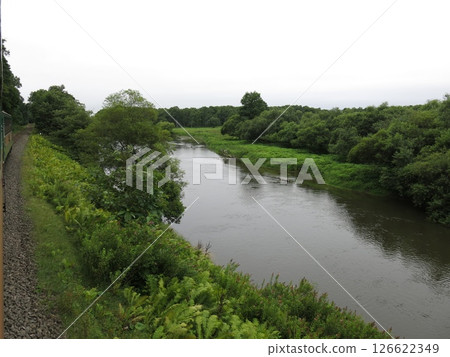 The Kushiro River in the Kushiro Marshlands as seen from the observation car of the Kushiro Norokko train (between Toji Station and Hosooka Station) 126622349