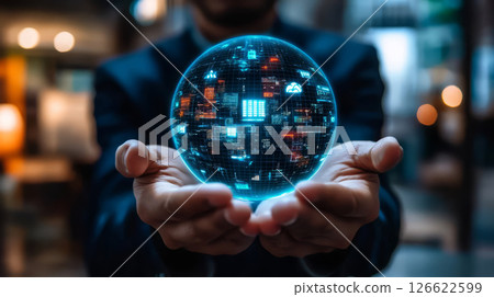 person holds glowing digital globe representing technology and data 126622599
