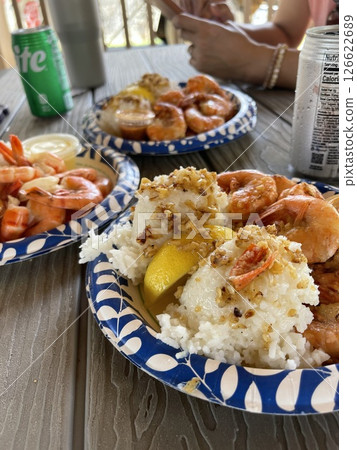Eating garlic shrimp under the blue Hawaiian sky will be a wonderful memory, a casual moment on your trip. 126622689