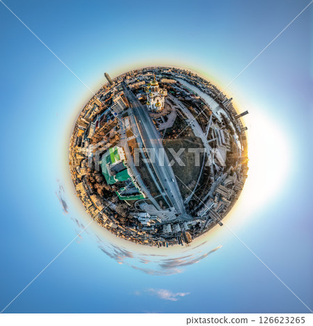 Aerial early spring or autumn city view with crossroads and roads, houses, buildings, parks and bridges. Copter shot. Little planet sphere mode. 126623265