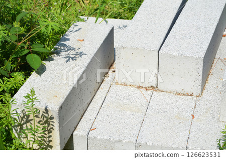 Construction materials piled up at a landscaping construction site 126623531