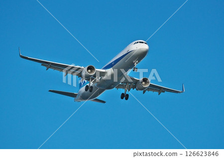 An ANA passenger plane approaching Haneda Airport, seen from Jonanjima Seaside Park on a clear winter day An ANA passenger plane approaching Haneda Airport, seen from Jonanjima Seaside Park on a clear winter day 126623846