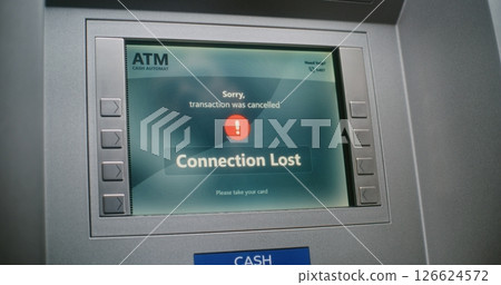 ATM User Entering PIN Code on ATM Keypad. Cancelled Transaction Due to Connection Loss ATM User Entering PIN Code on ATM Keypad. Cancelled Transaction Due to Connection Loss 126624572
