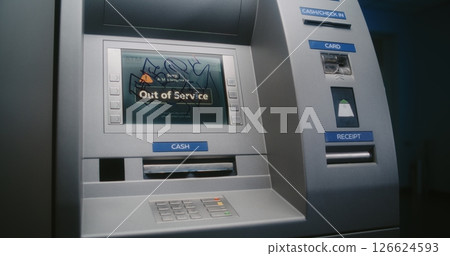 Unrecognizable Vandal in Hoodie Marking ATM Screen with Graffiti Using Marker Pen Unrecognizable Vandal in Hoodie Marking ATM Screen with Graffiti Using Marker Pen 126624593