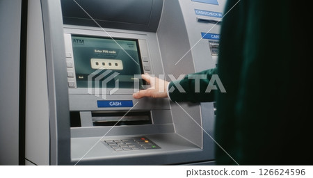 Unrecognizable Person Entering PIN Code. Error Message on Cash Machine Due to Incorrect PIN Code Unrecognizable Person Entering PIN Code. Error Message on Cash Machine Due to Incorrect PIN Code 126624596