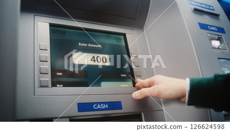 ATM User Entering PIN Code. Error Message on Cash Machine Screen Due to Lack of Cash ATM User Entering PIN Code. Error Message on Cash Machine Screen Due to Lack of Cash 126624598