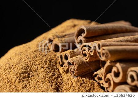 Fine Ground Cinnamon with Cinnamon Sticks. Natural Cooking Spice Fine Ground Cinnamon with Cinnamon Sticks. Natural Cooking Spice 126624620