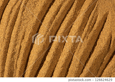 Texture of Ground Cinnamon. Natural Culinary Background Top View Texture of Ground Cinnamon. Natural Culinary Background Top View 126624629
