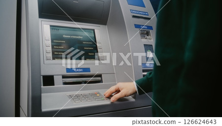 Unrecognizable Person Entering PIN Code. Error Message on Cash Machine Display Due to No Cash Available Unrecognizable Person Entering PIN Code. Error Message on Cash Machine Display Due to No Cash Available 126624643