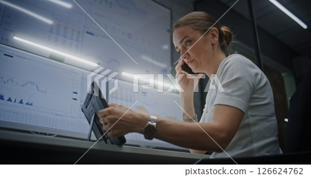 Female Financial Analyst Talking on Phone, Suffering from Financial Crisis, Analyzing Exchange Market Charts 126624762