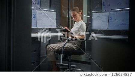 Female Financial Analyst Monitoring Exchange Market Charts on Multiple Digital Devices and Computer Female Financial Analyst Monitoring Exchange Market Charts on Multiple Digital Devices and Computer 126624827