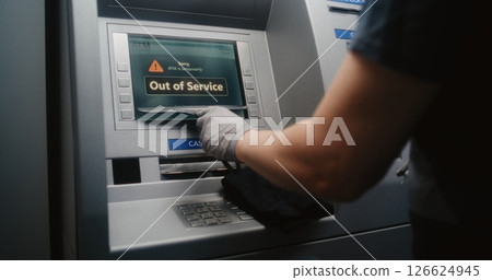 Cleaning Service Specialist Wiping Out of Service ATM with Microfiber Cloth 126624945