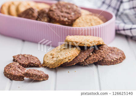Sweet oatmeal cookies on white table. Sweet oatmeal cookies on white table. 126625140