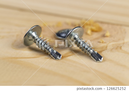 wooden board made of pine and self-tapping screws for wood wooden board made of pine and self-tapping screws for wood 126625252