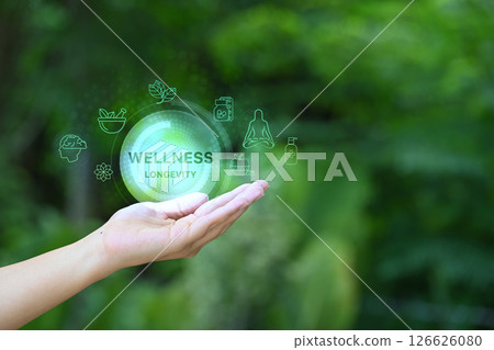 Open hand holding virtual icons representing longevity, health, and holistic wellbeing Open hand holding virtual icons representing longevity, health, and holistic wellbeing 126626080