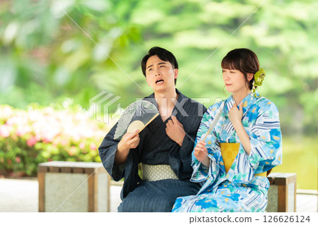 A couple in yukata cooling off in a gazebo A couple in yukata cooling off in a gazebo 126626124