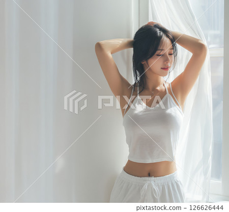 Young woman raising her arms, beautiful skin and armpit hair removal image 126626444