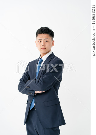 Young male business arms crossed 126628212