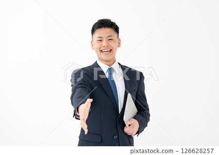 Young men business handshake Young men business handshake 126628257
