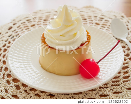 Homemade pudding with cream and cherries 126628302