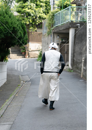 Craftsman, Nikkapokka, walking, back view Craftsman, Nikkapokka, walking, back view 126628357
