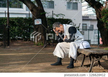 Craftsman, Nikkapokka, tired, sitting 126628412