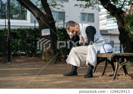 Craftsman, Nikkapokka, tired, sitting 126628413