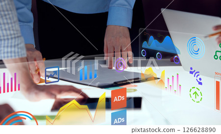 Conceptual collage. Close-up of hands interacting with vibrant holographic panels showing marketing stats, ad indicators and tech diagrams 126628890
