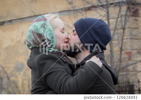 Cheerful young couple expressing their feelings on the street Cheerful young couple expressing their feelings on the street 126628891